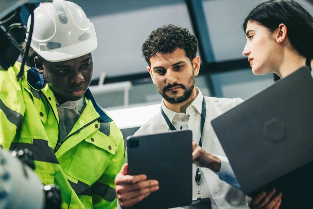 A team reviews incident information on a tablet.