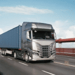A truck transports goods down a freeway.