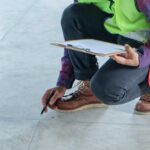 An inspector uses a workplace floor inspection template.