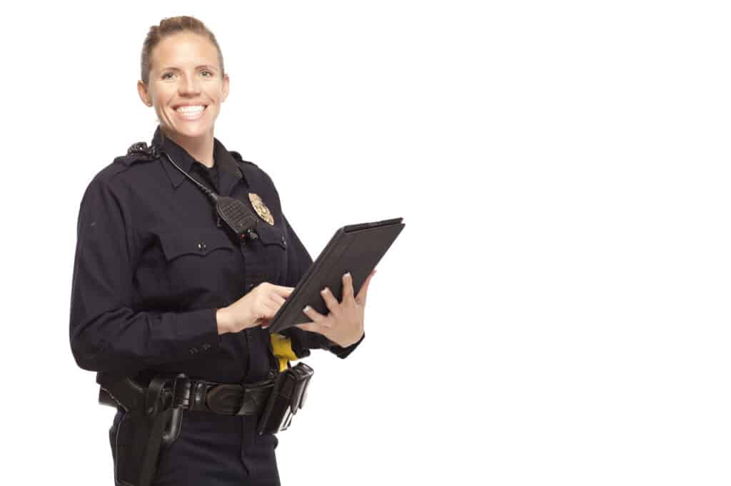 An officer is happy to use a mobile device with the 1st Reporting app for document completion.
