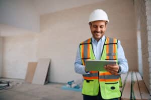 A construction manager happily completes a site condition report template.