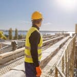 A construction worker contemplates near-miss reporting at remote job sites after almost being injured.