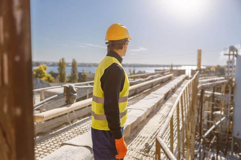 A construction worker contemplates near-miss reporting at remote job sites after almost being injured.