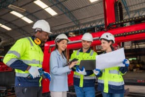 An engineer shows her team how to use the emergency action plan checklist on mobile devices.