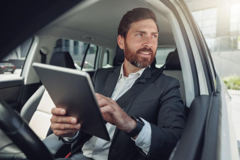 A business man uses a tablet and the 1st Reporting application for his vehicle condition report writing. Learn more about mobile reporting at 1stReporting.com.