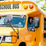 A school bus driver is happy to use a digital school bus inspection checklist for pre-use daily inspections.