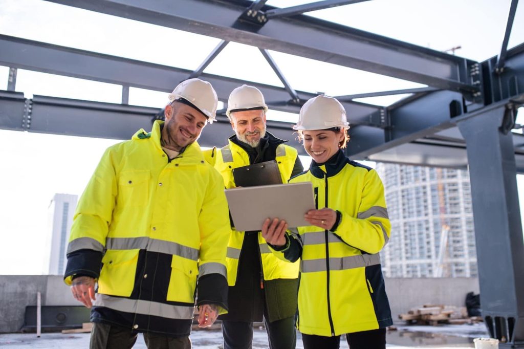 A team of safety managers reviews a safety inspection created with 1st Reporting app.