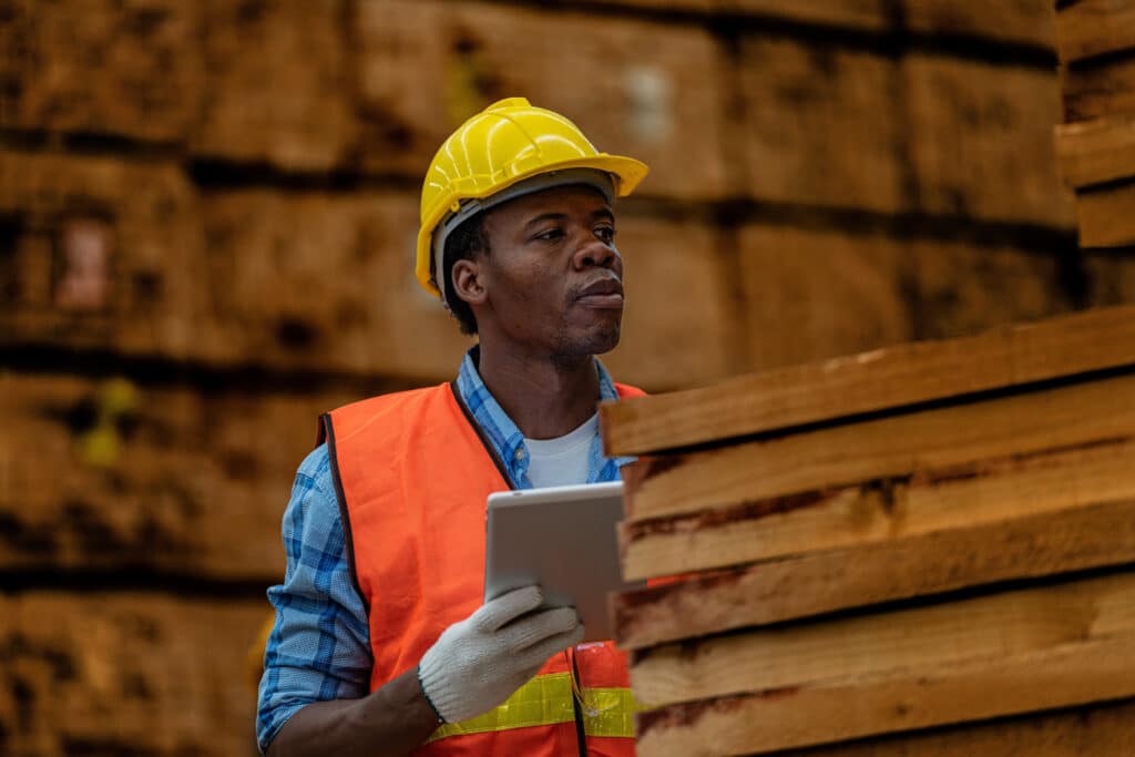 Worker with tablet for health and safety risk assessment