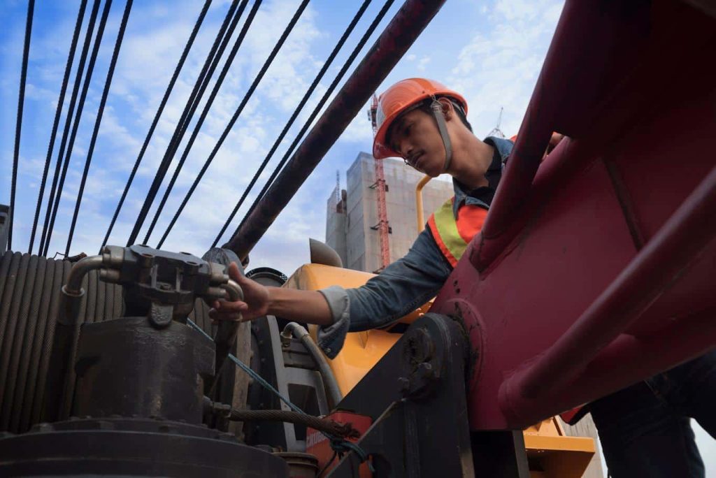 A crane operator reviews the daily mobile crane inspection points using the 1st Reporting app. Learn more about mobile crane inspection and reporting at 1stReporting.com.