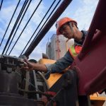A crane operator reviews the daily mobile crane inspection points using the 1st Reporting app. Learn more about mobile crane inspection and reporting at 1stReporting.com.
