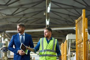 Management reviewing a Warehouse Checklist Template by 1streporting.com