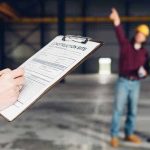 A manager completes a Site Visit Report template by 1stReporting.com.
