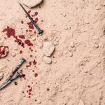 Nails and blood at a worksite shows the importance of bloodborne pathogens safety at work.