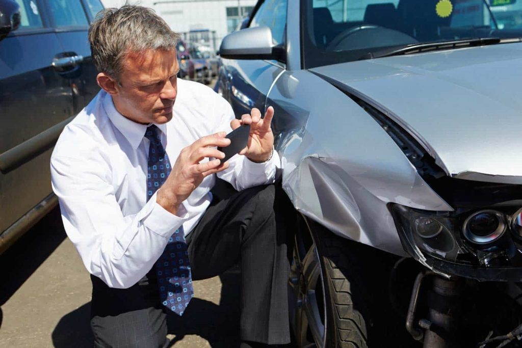 A manager proceeds with documenting photos to save with his vehicle condition report document. Did you know the 1st Reporting app is one of the easiest ways to manage vehicle condition report writing? Learn more at 1stReporting.com.