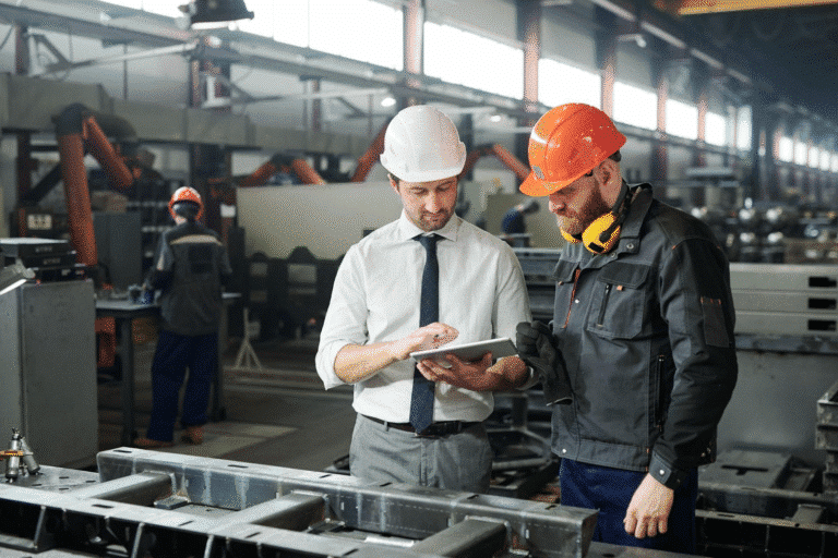 A manager and foreman improve asset management with the 1st Reporting app on a mobile tablet.