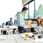 A supervisor discusses and Employee Disciplinary Form with a team member. Learn more at 1stReporting.com.