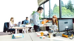 A supervisor discusses and Employee Disciplinary Form with a team member. Learn more at 1stReporting.com.