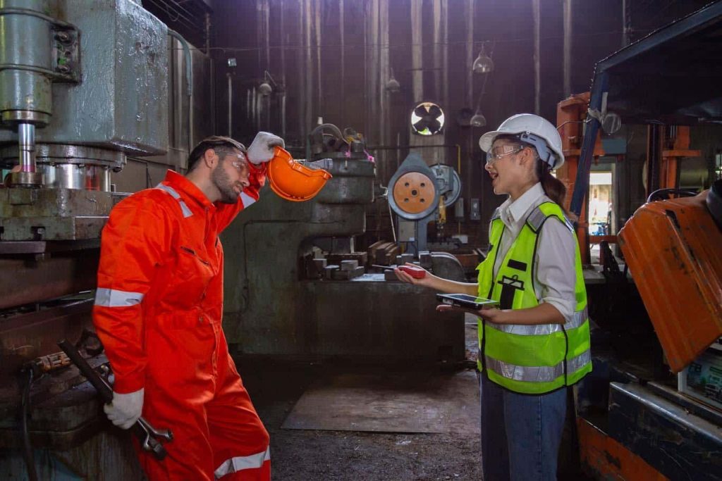 Two workers complete the mobile compliance checklist on their tablets. Learn more about mobile compliance auditing at 1stReporting.com.