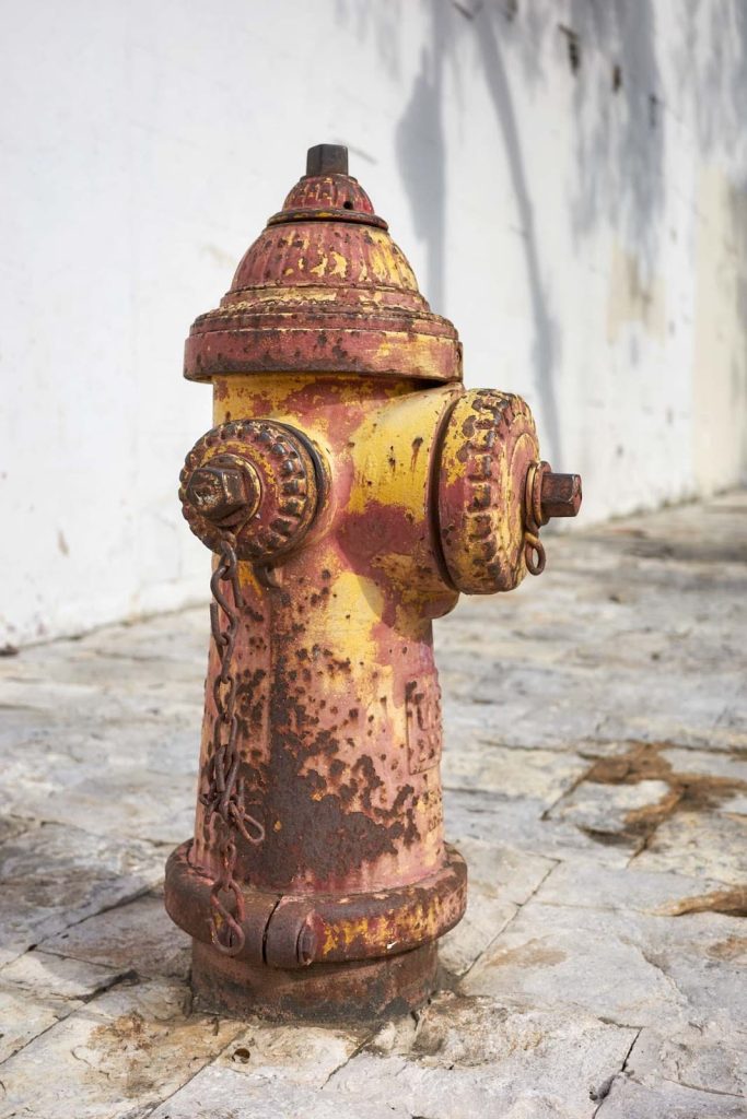 An old and weathered fire hydrant in Ecuador. 