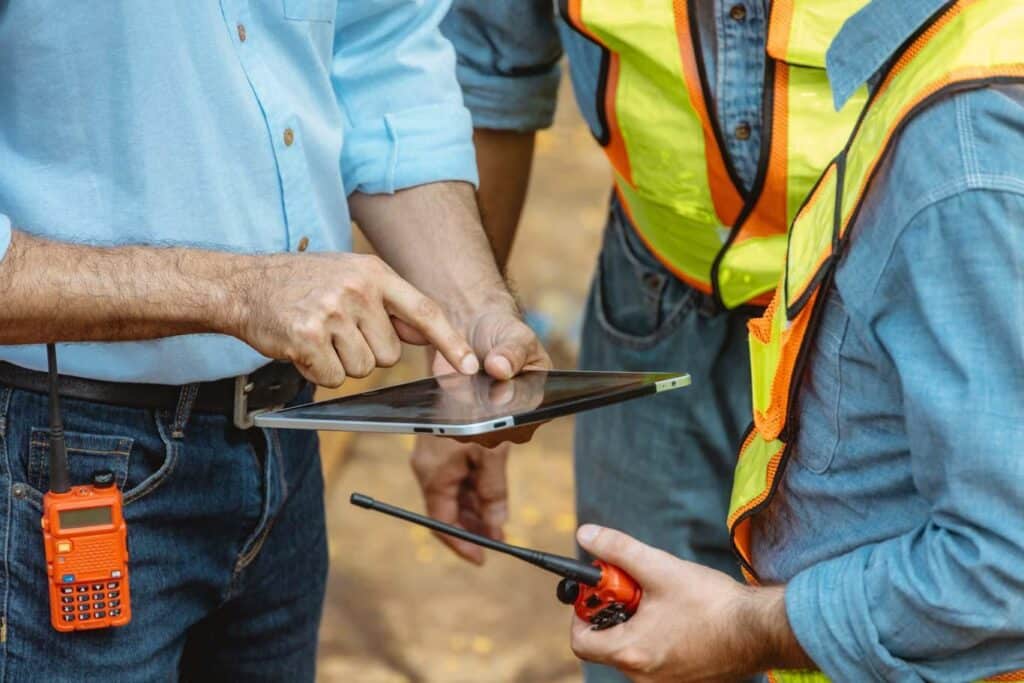 Utility workers learn to use reporting tools for safety compliance during digital onboarding.