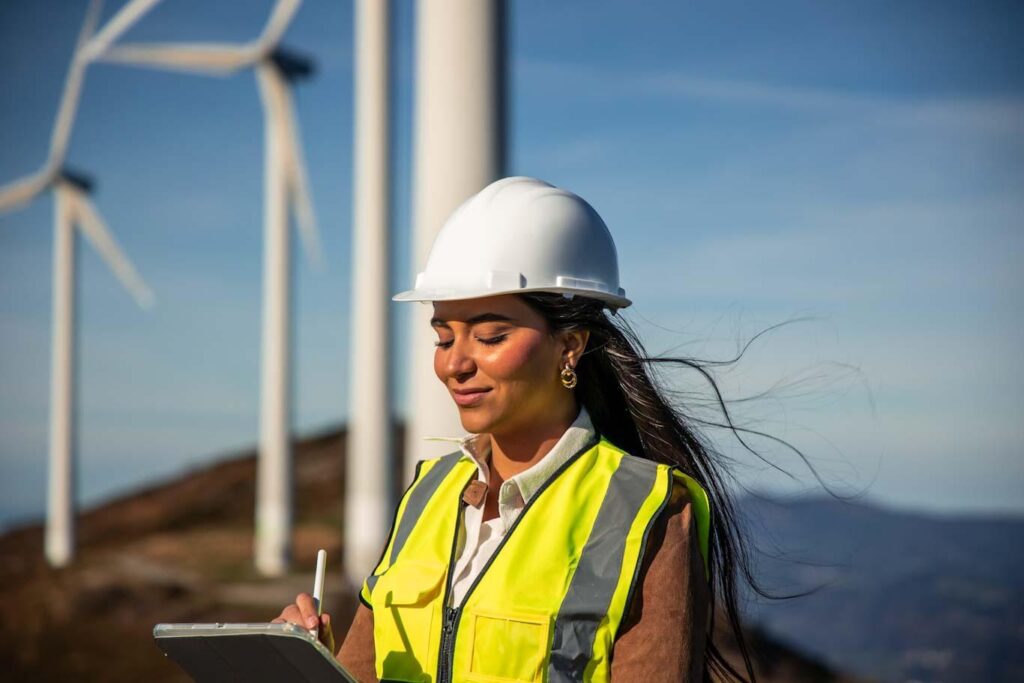 A utilities supervisor happily reviews a digital report as a part of the company’s digital transformation.