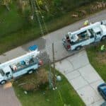 Utility crews performing emergency repairs documentable with emergency response reporting tools.