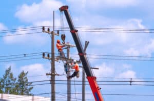 Three electricians work at remote utility sites requiring offline reporting tools.